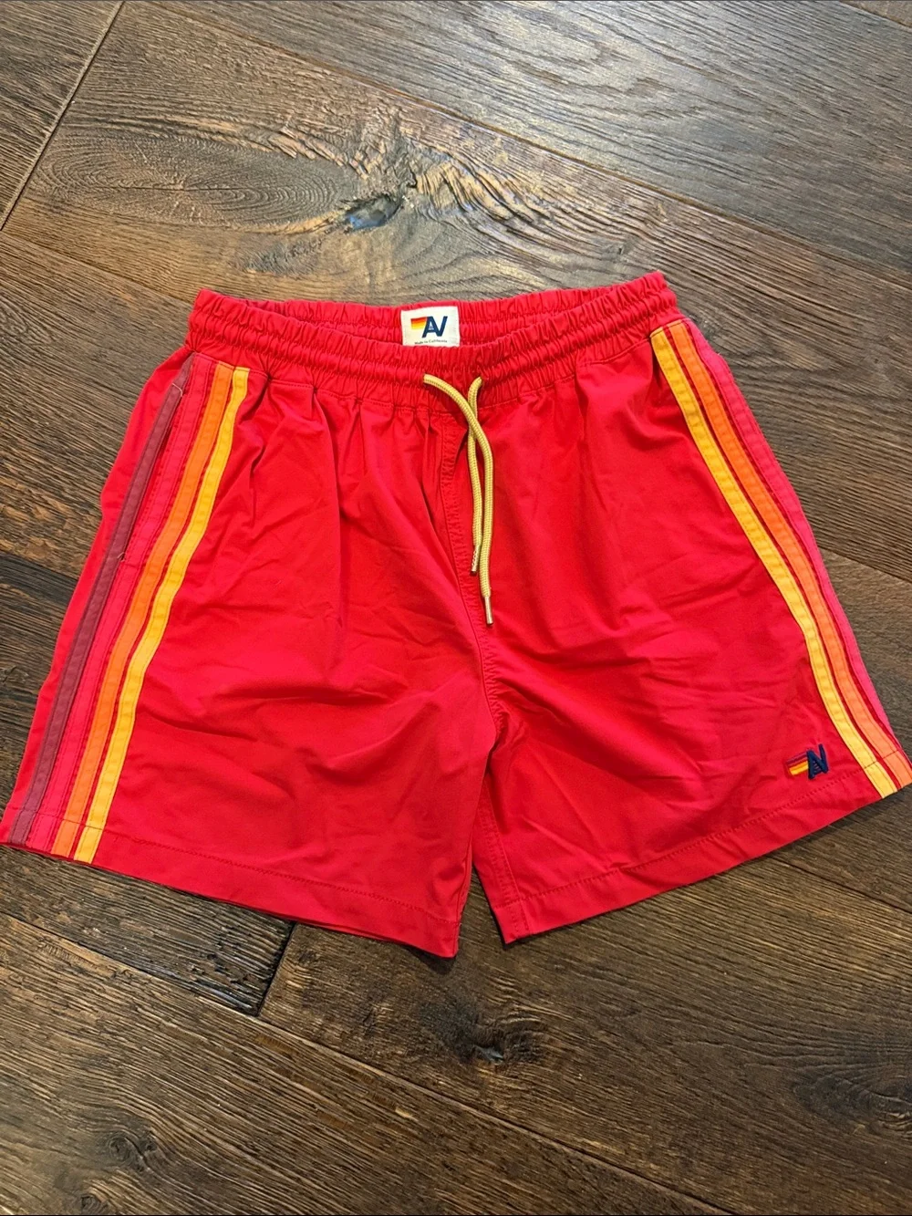 Aviator Nation Red Kids Swim Trunks with Yellow & Orange Stripes